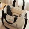 S04c77a1ccaa344208a1bfe33b0d441bf8.webp Sac fourre-tout en toile à motif floral « Plant Yo