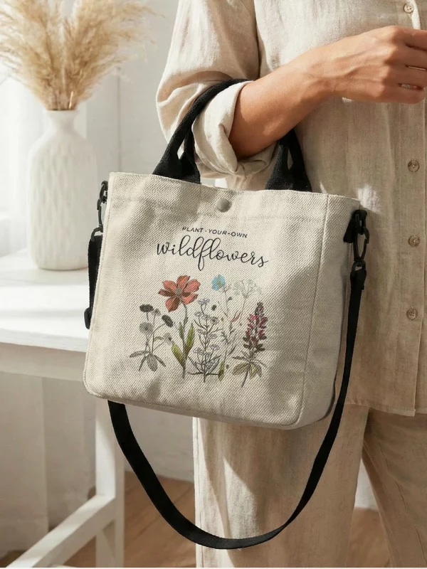 S2e624ca04e4f4dcd91a4f6029cd6cddf9.webp Sac fourre-tout en toile à motif floral « Plant Yo