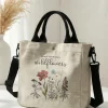 S3374bb1331a640739504cd7b728115b8b.webp Sac fourre-tout en toile à motif floral « Plant Yo