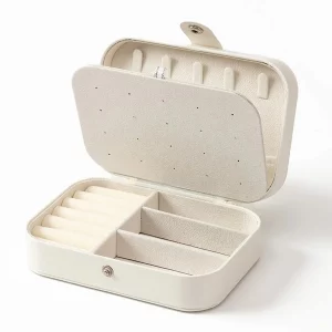 Boîte à bijoux portable mini en cuir PU, doublée d