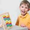 S7ae02eee3c084ba486a140a7a84f6116e.webp Boulier Montessori en Bois 100 Perles Éducatives